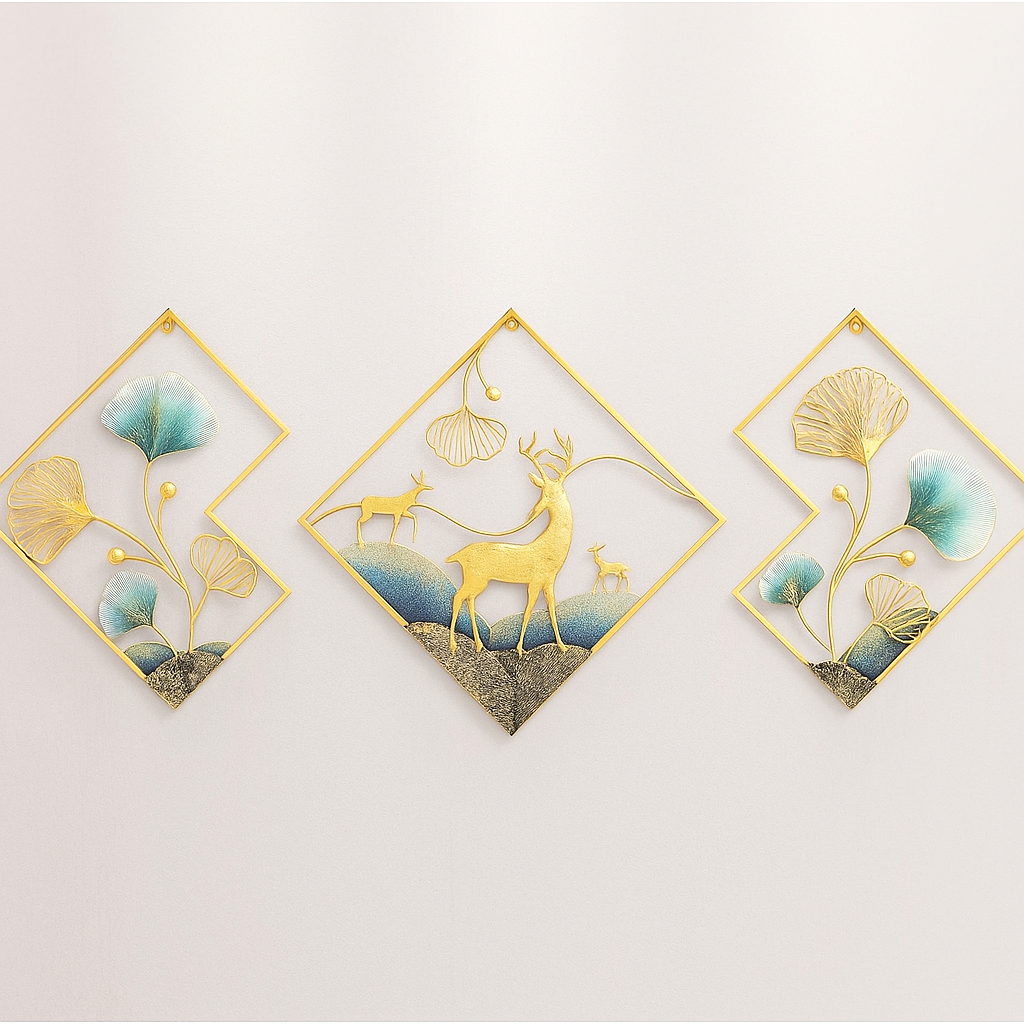 Decorative wall art pieces with deer and ginkgo leaves on a light gray background